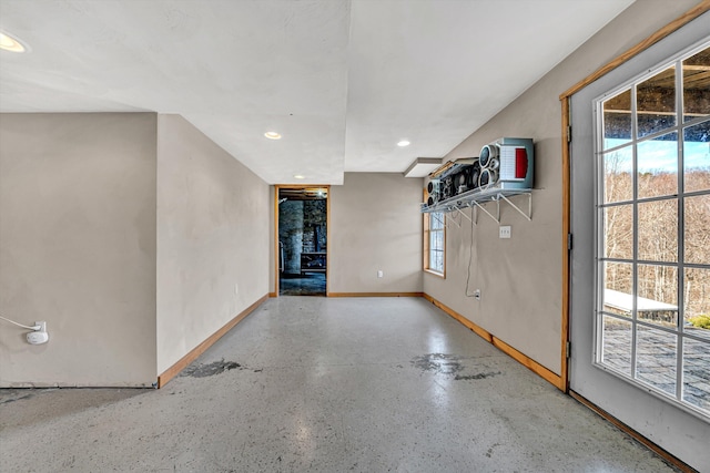 interior space with recessed lighting and baseboards