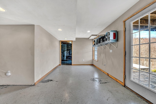 empty room with recessed lighting and baseboards