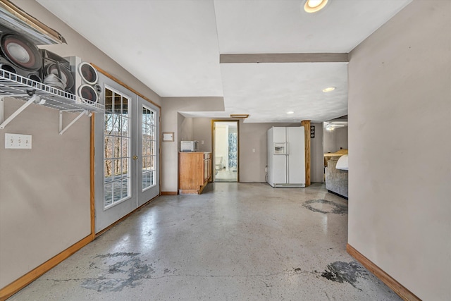 entryway featuring recessed lighting, french doors, and baseboards