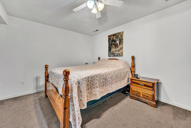 bedroom with carpet flooring, ceiling fan, visible vents, and baseboards