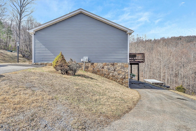 view of property exterior featuring stone siding