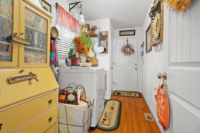 4348 Stewartsville Rd, Moneta, VA 24121 - laundry room featuring washer and dryer and hardwood / wood-style flooring