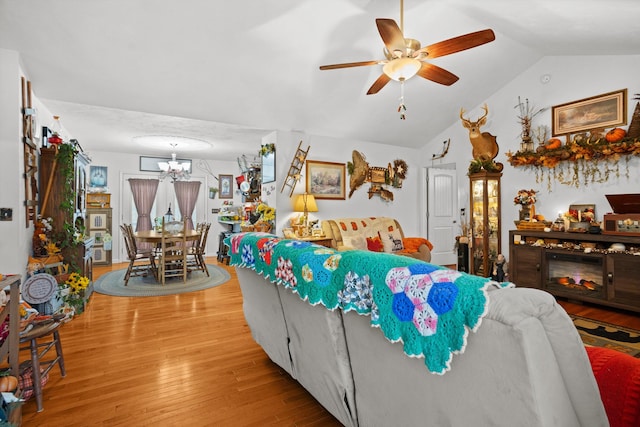4348 Stewartsville Rd, Moneta, VA 24121 - living room with hardwood / wood-style floors, ceiling fan with notable chandelier, and vaulted ceiling