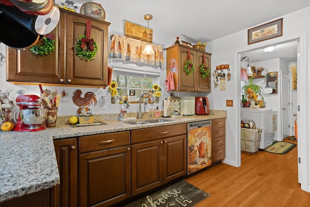 4348 Stewartsville Rd, Moneta, VA 24121 - kitchen featuring sink, dishwasher, hanging light fixtures, washer / dryer, and light wood-type flooring