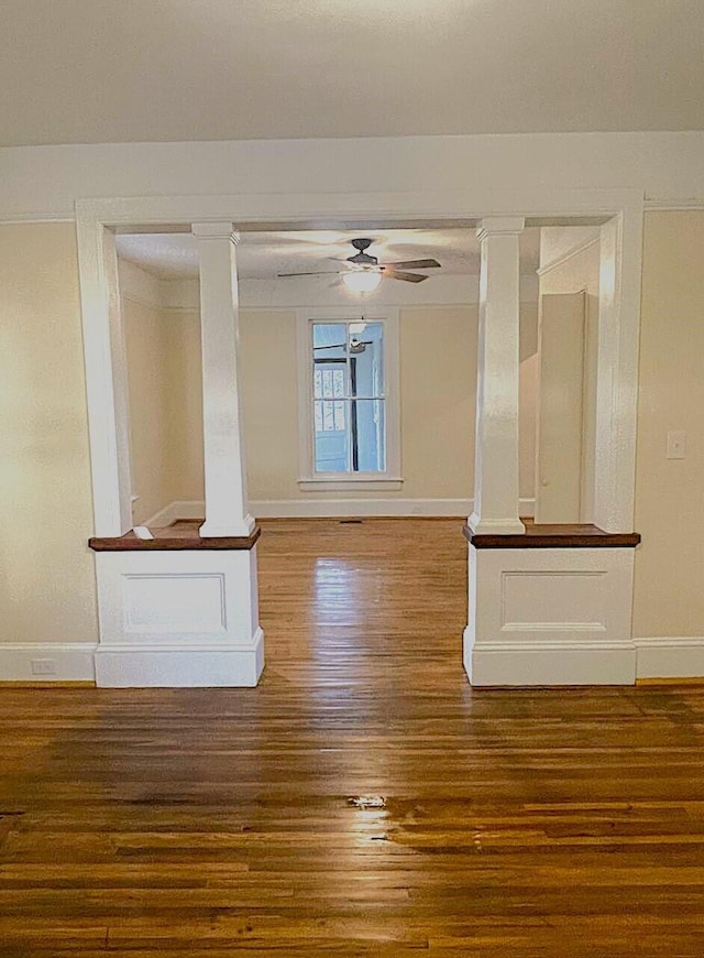 unfurnished room with ceiling fan and dark hardwood / wood-style floors