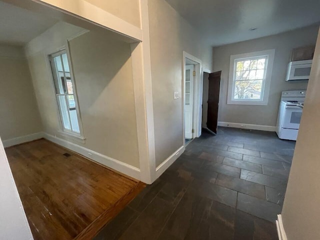 hall with dark wood-type flooring