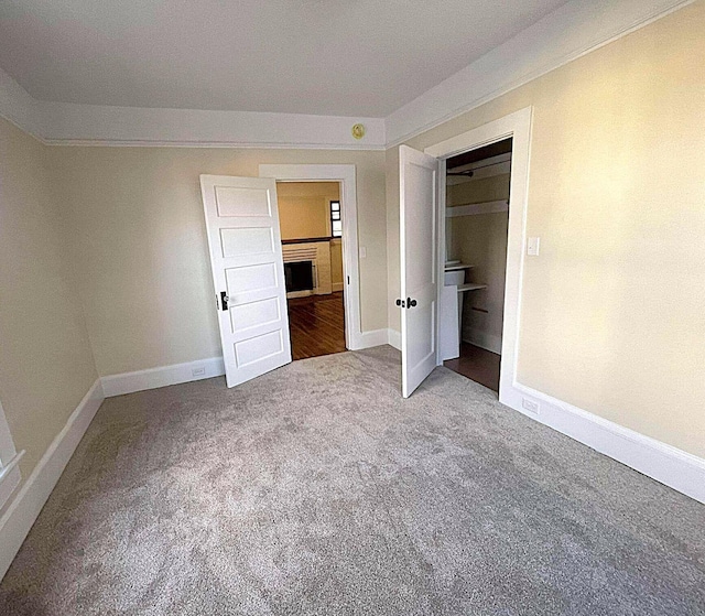 unfurnished bedroom featuring a closet and carpet floors