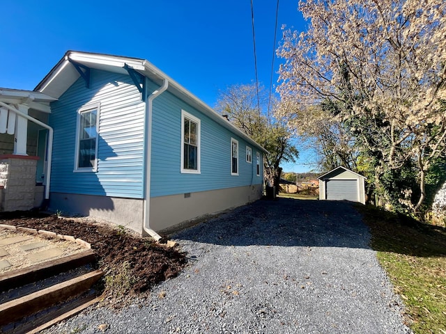 view of home's exterior with an outbuilding and a garage