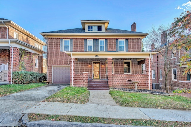 view of front of house with central AC and a garage