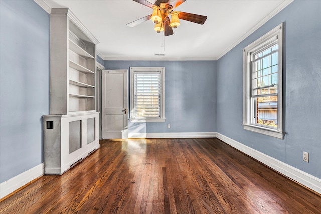 unfurnished living room with dark hardwood / wood-style flooring, ceiling fan, and crown molding