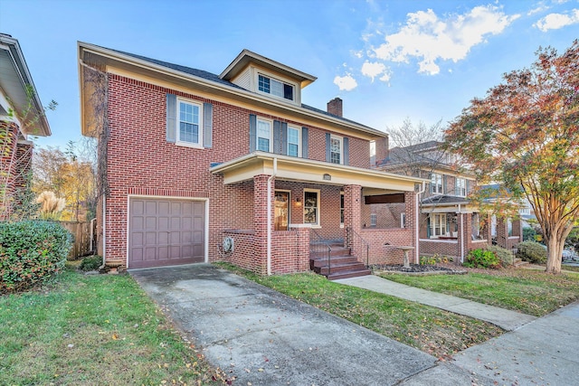 view of front facade with a porch, a garage, and a front lawn