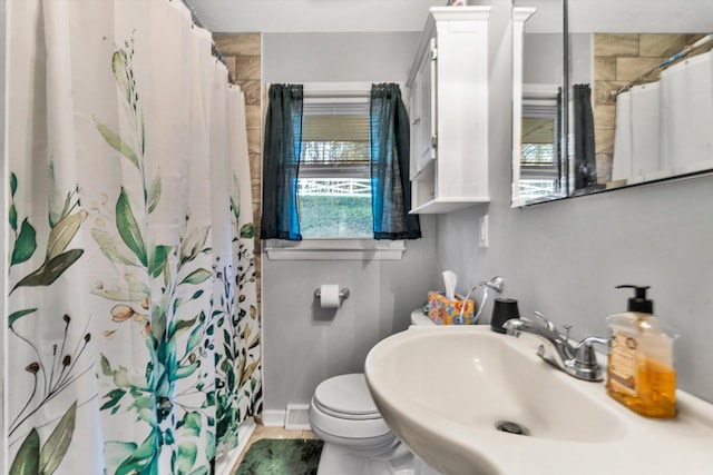 bathroom featuring sink and toilet