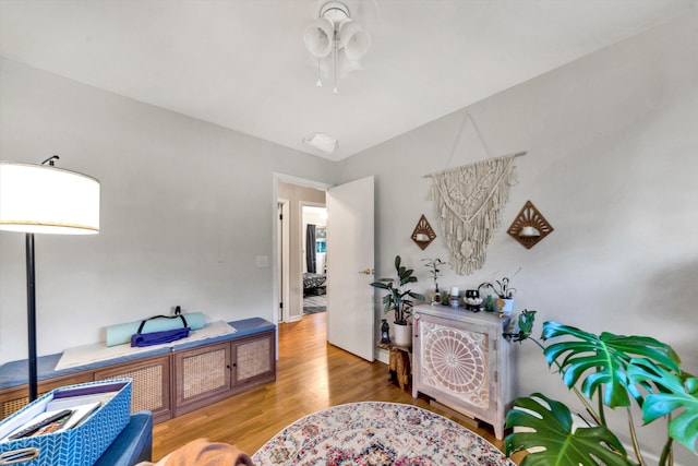 living area with hardwood / wood-style floors