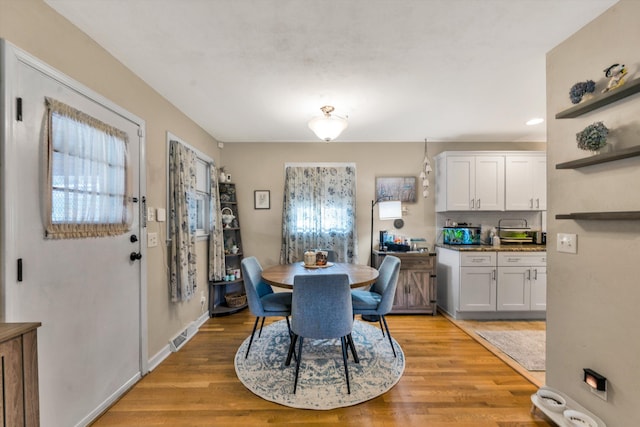 dining room featuring light hardwood / wood-style floors