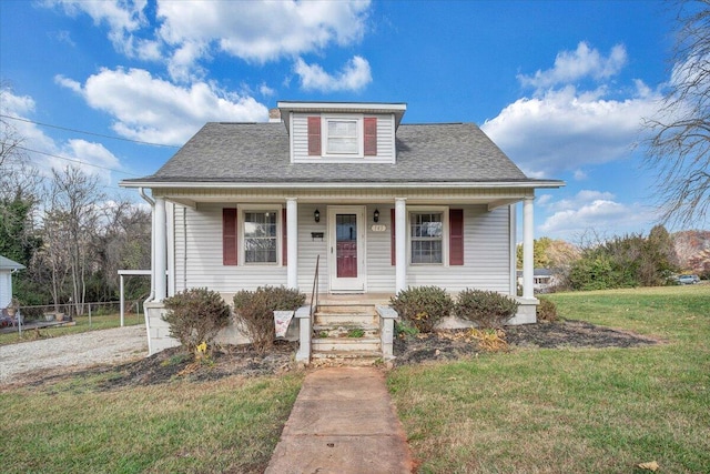 bungalow-style house featuring a porch and a front yard