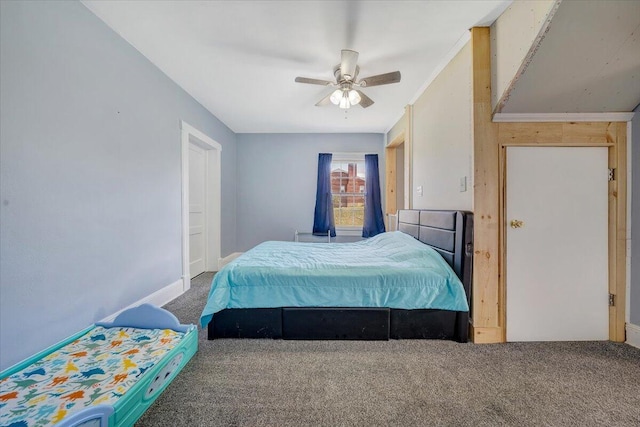 bedroom featuring ceiling fan, crown molding, and carpet floors