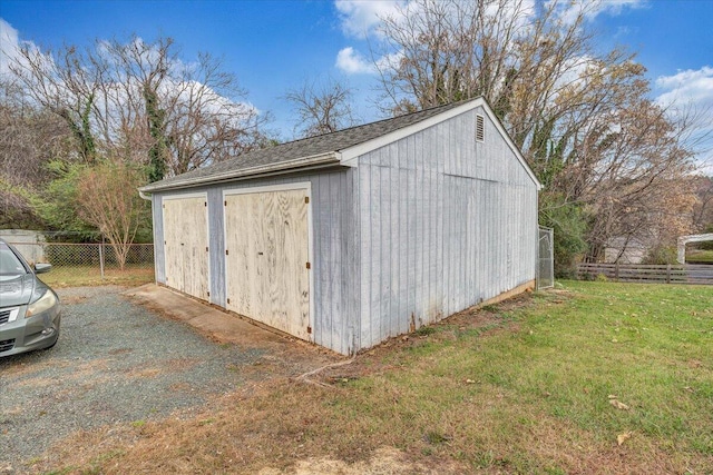 view of outdoor structure with a lawn