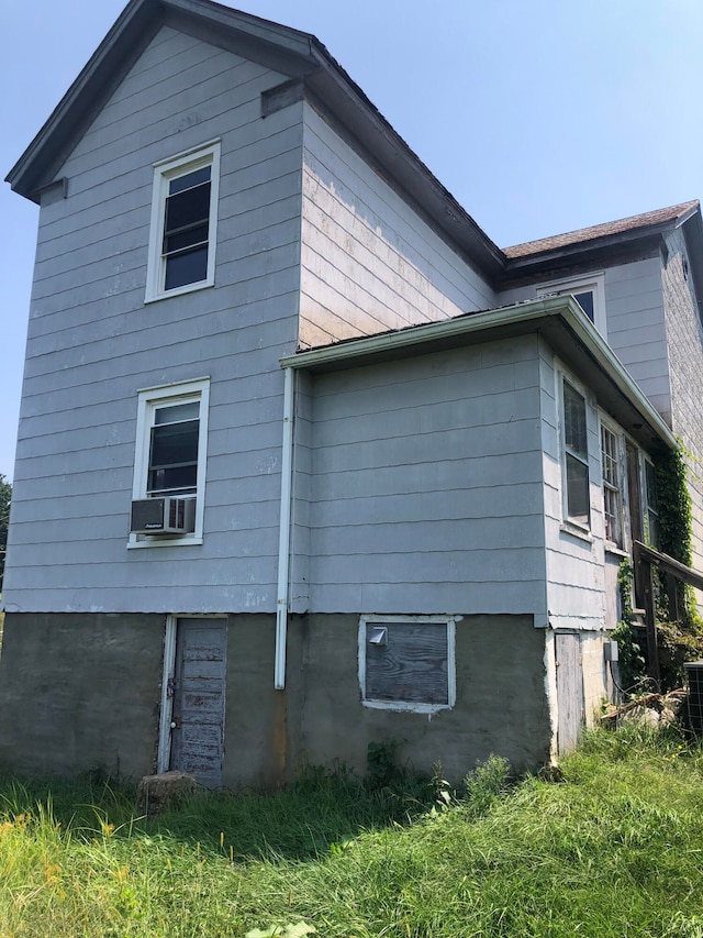 view of home's exterior featuring cooling unit