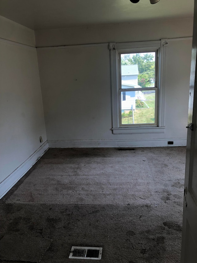 unfurnished room featuring carpet floors