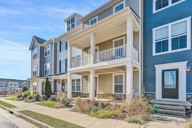 multi unit property featuring a balcony