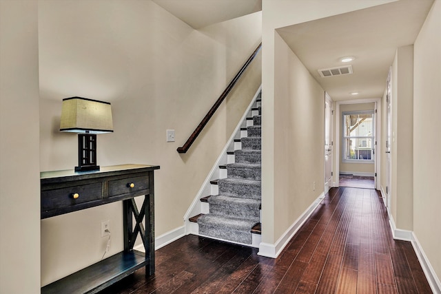 stairs featuring hardwood / wood-style flooring