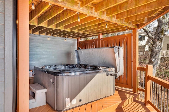 wooden terrace with a hot tub