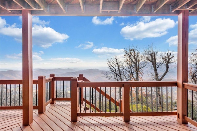 wooden deck featuring a mountain view