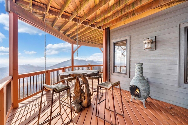 wooden terrace with a mountain view