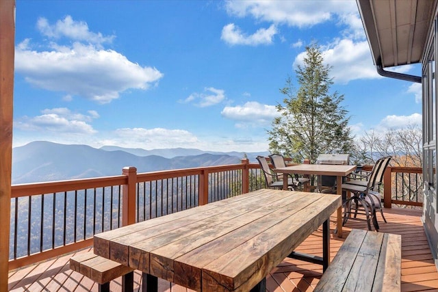 wooden deck featuring a mountain view