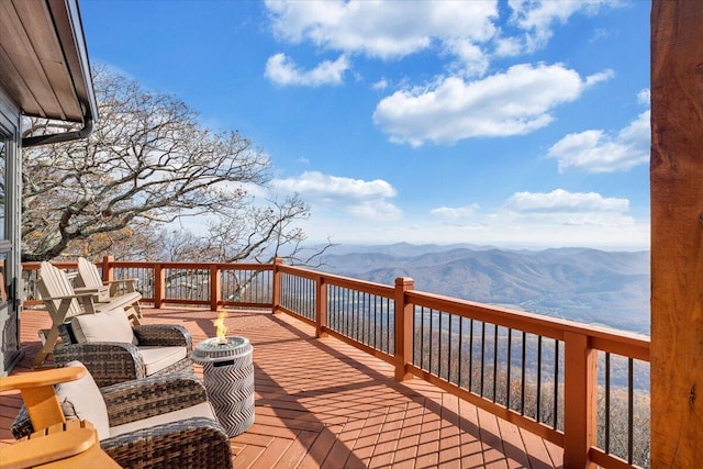 wooden terrace with a mountain view