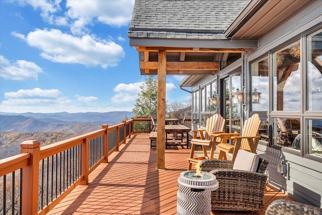 wooden terrace featuring a mountain view