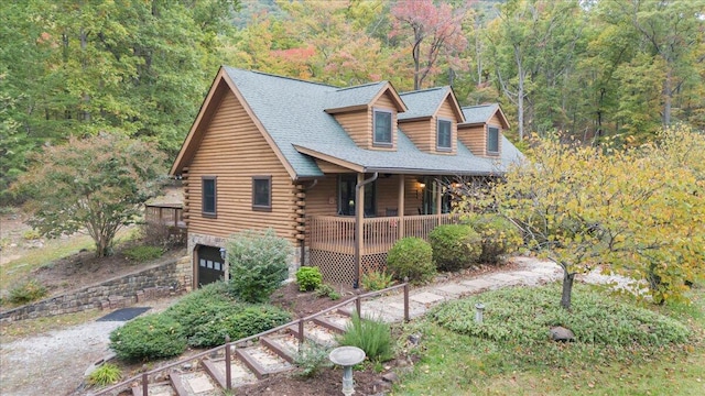 view of front facade featuring a garage and covered porch