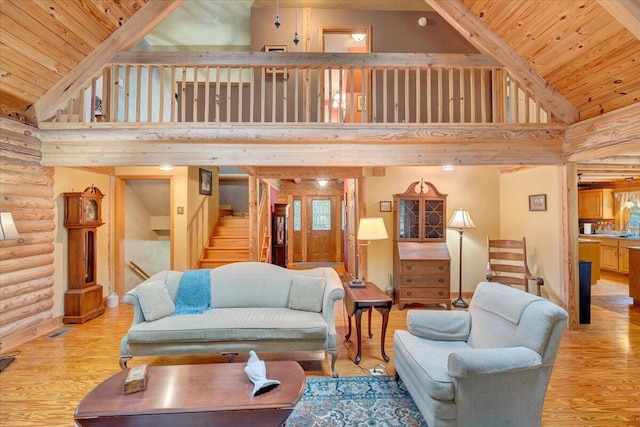 living room featuring wood ceiling, light hardwood / wood-style floors, and rustic walls