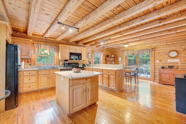 kitchen featuring sink, hanging light fixtures, a center island, black appliances, and wooden ceiling