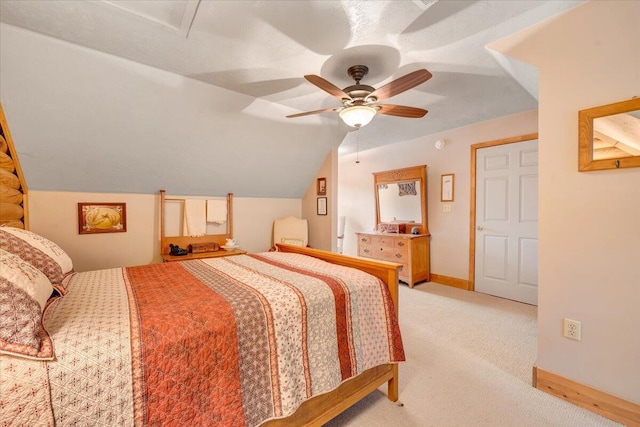 carpeted bedroom featuring lofted ceiling and ceiling fan