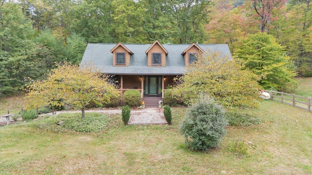 view of front of property with covered porch and a front lawn