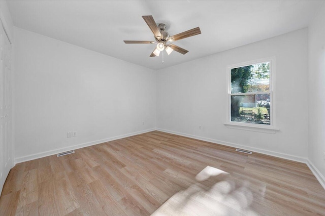 spare room with light hardwood / wood-style floors and ceiling fan