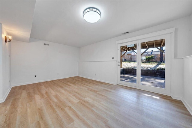 spare room with light wood-type flooring