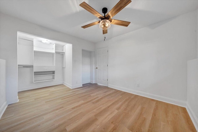 unfurnished bedroom featuring ceiling fan, light hardwood / wood-style floors, and a closet