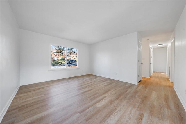 unfurnished room featuring light hardwood / wood-style flooring