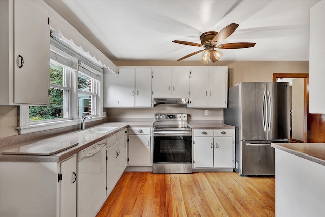 kitchen with white cabinetry, ceiling fan, sink, light hardwood / wood-style flooring, and appliances with stainless steel finishes