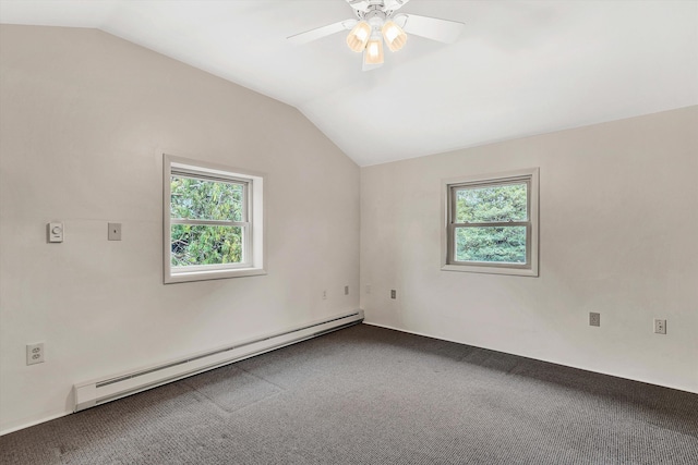 unfurnished room with carpet floors, baseboard heating, a wealth of natural light, and vaulted ceiling