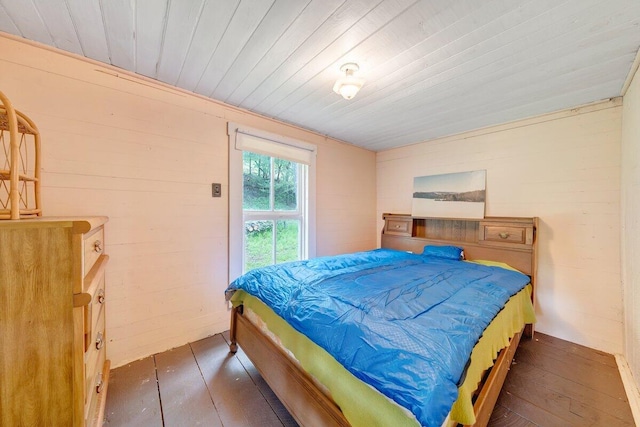 bedroom featuring wooden ceiling and dark wood-type flooring