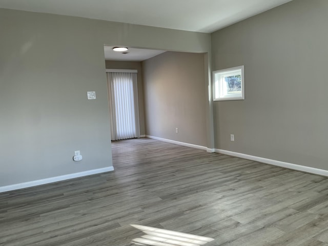 spare room with light wood-type flooring