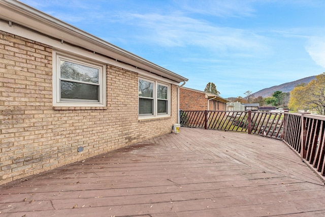 wooden deck featuring a mountain view