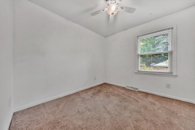 spare room with ceiling fan and carpet floors