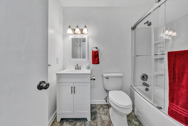 full bathroom featuring vanity, toilet, and shower / bath combination with glass door