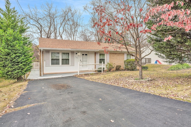 ranch-style home with covered porch