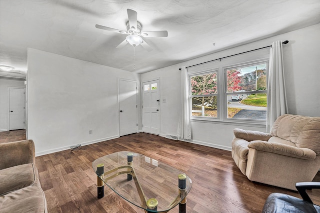 living room with ceiling fan and dark hardwood / wood-style floors