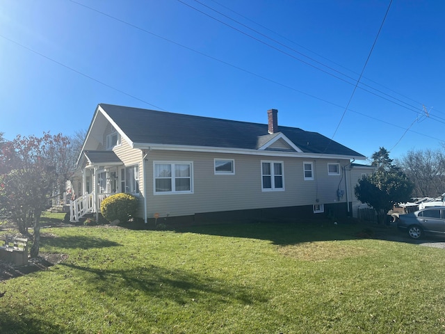 view of property exterior with a lawn